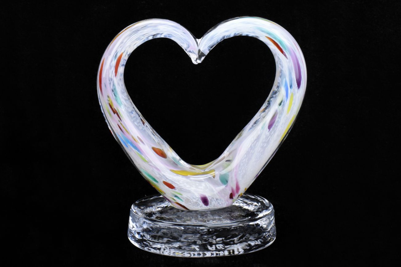 Art Glass Heart Within a Heart on an Oval Base.